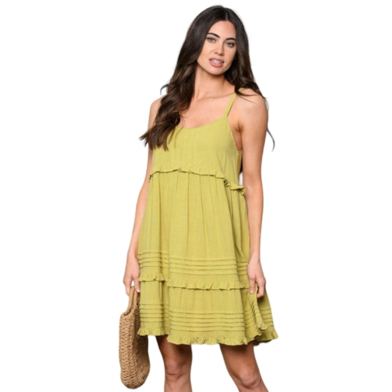 Cette robe tunique C'est Elle est dotée de volants à l'ourlet pour une touche féminine. Elle offre un mélange de modernité et d'élégance. Vous aimez la lime et citron ? Portez la robe tunique C'est Elle.